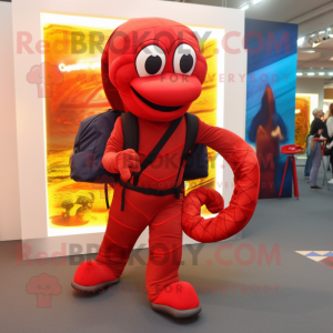 Red Snake mascot costume character dressed with a Jumpsuit and Backpacks