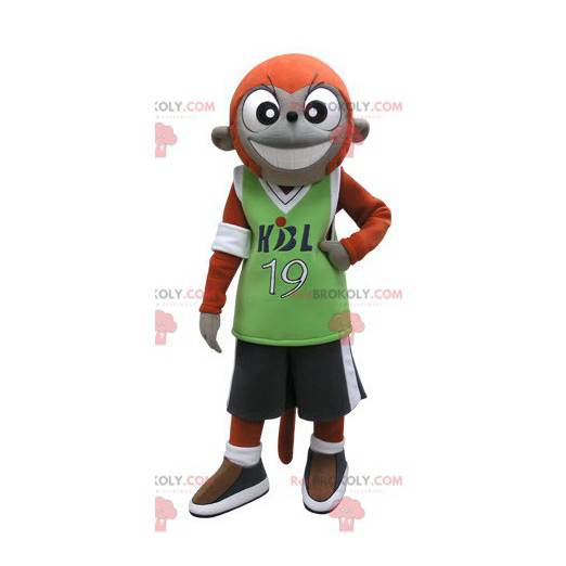 Mascote macaco laranja e cinza em roupas esportivas -