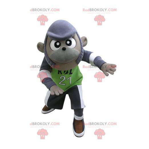 Mascotte de singe violet et gris en tenue de sport -