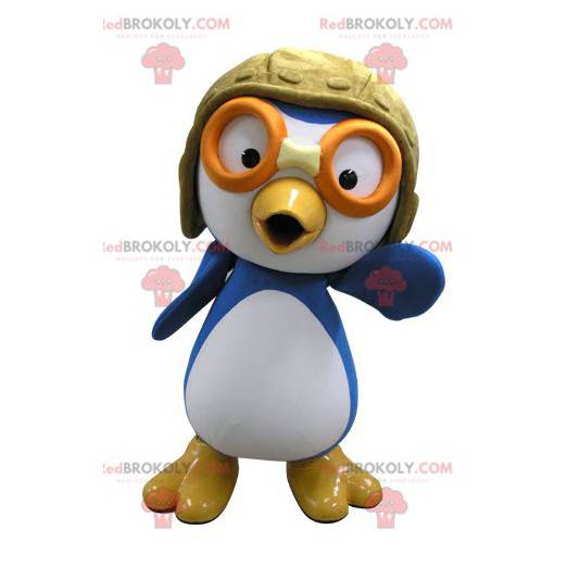 Mascotte uccello blu e bianco in abito da aviatore -