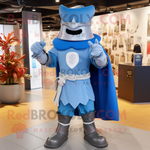 Blue Medieval Knight mascot costume character dressed with a Boyfriend Jeans and Hat pins