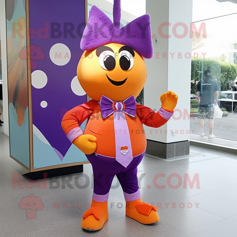 Purple Apricot mascot costume character dressed with a Graphic Tee and Bow ties Purple Apricot mascot costume character dressed with a Graphic Tee and Bow ties