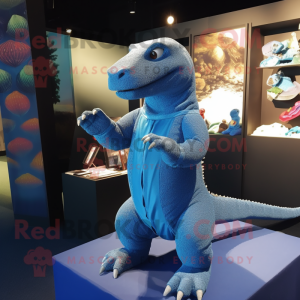 Blue Komodo Dragon mascot costume character dressed with a Cardigan and Foot pads