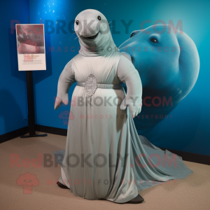 Silver Stellar'S Sea Cow mascot costume character dressed with a Empire Waist Dress and Ties