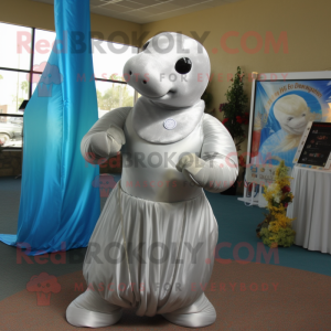 Silver Stellar'S Sea Cow mascot costume character dressed with a Empire Waist Dress and Ties