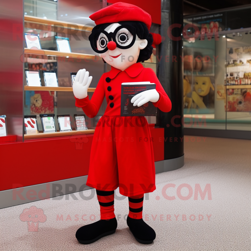 Red Mime mascot costume character dressed with a Culottes and Reading glasses