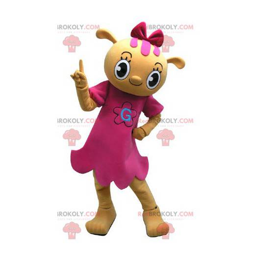 Gelbes Teddybärmaskottchen gekleidet in einem rosa Kleid -