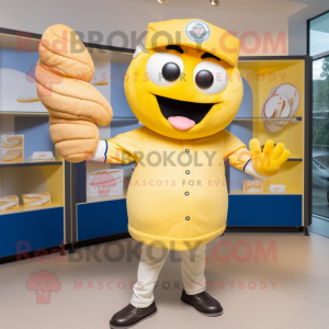 Lemon Yellow Croissant mascot costume character dressed with a Baseball Tee and Hat pins