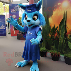 Blue Chupacabra mascot costume character dressed with a Maxi Skirt and Caps