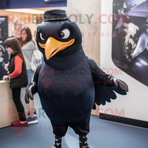 Navy Blackbird mascot costume character dressed with a Graphic Tee and Mittens