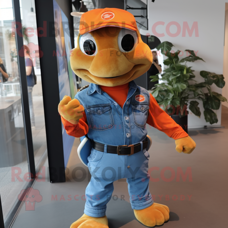 Orange Turtle mascot costume character dressed with a Denim Shirt and Brooches Orange Turtle mascot costume character dressed with a Denim Shirt and Brooches