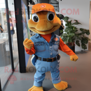 Orange Turtle mascot costume character dressed with a Denim Shirt and Brooches