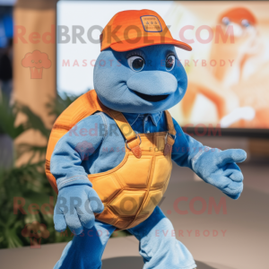 Orange Turtle mascot costume character dressed with a Denim Shirt and Brooches