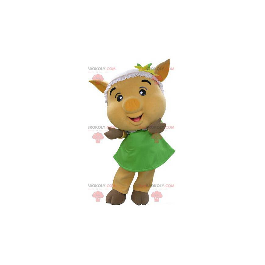 Gelbes Schweinemaskottchen mit einem grünen Kleid -