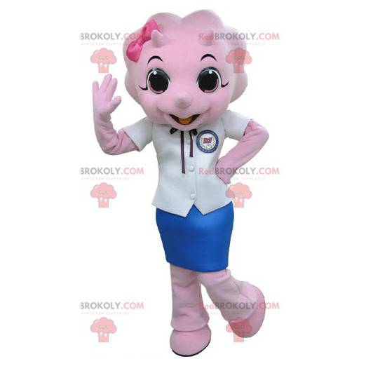 Mascote do rinoceronte rosa vestido com uma saia -