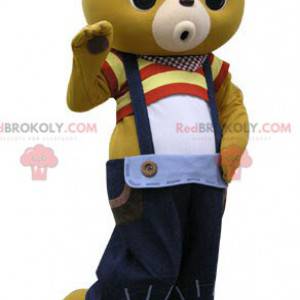 Mascotte de nounours jaune avec un pantalon à bretelles -