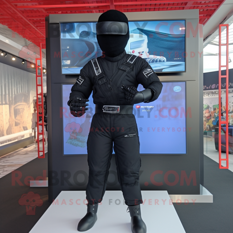 Black Ninja mascot costume character dressed with a Jumpsuit and Suspenders Black Ninja mascot costume character dressed with a Jumpsuit and Suspenders