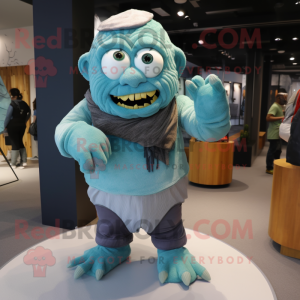 Cyan Frankenstein'S Monster mascot costume character dressed with a Corduroy Pants and Scarves