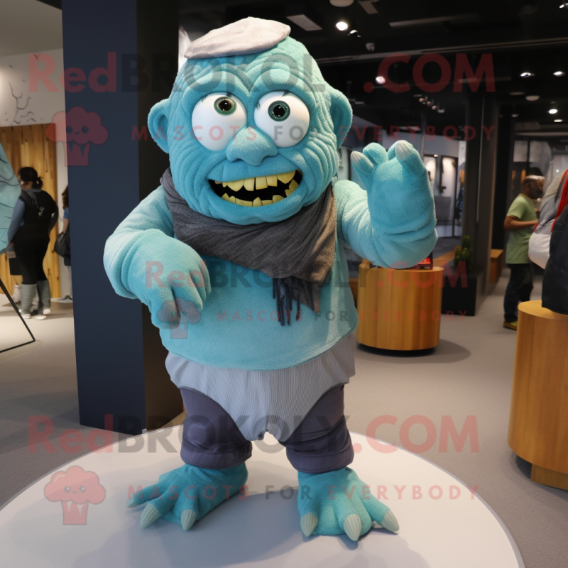 Cyan Frankenstein'S Monster mascot costume character dressed with a Corduroy Pants and Scarves