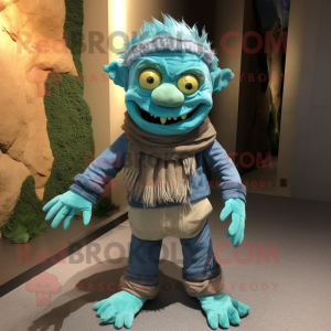 Cyan Frankenstein'S Monster mascot costume character dressed with a Corduroy Pants and Scarves