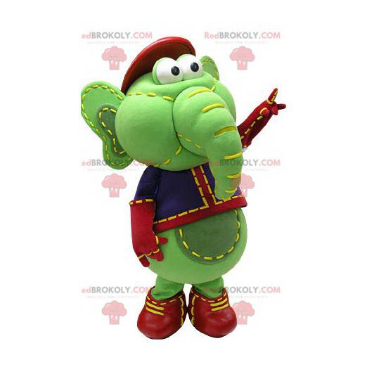 Grøn og gul elefantmaskot i blå og rød tøj - Redbrokoly.com