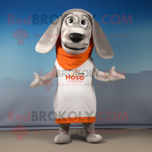 Silver Hot Dogs mascot costume character dressed with a Swimwear and Shawl pins