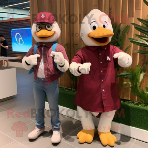 Maroon Swans mascot costume character dressed with a Boyfriend Jeans and Smartwatches