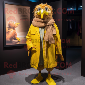 Yellow Canary mascot costume character dressed with a Corduroy Pants and Shawl pins