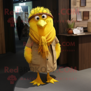 Yellow Canary mascot costume character dressed with a Corduroy Pants and Shawl pins