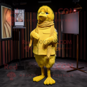 Yellow Canary mascot costume character dressed with a Corduroy Pants and Shawl pins