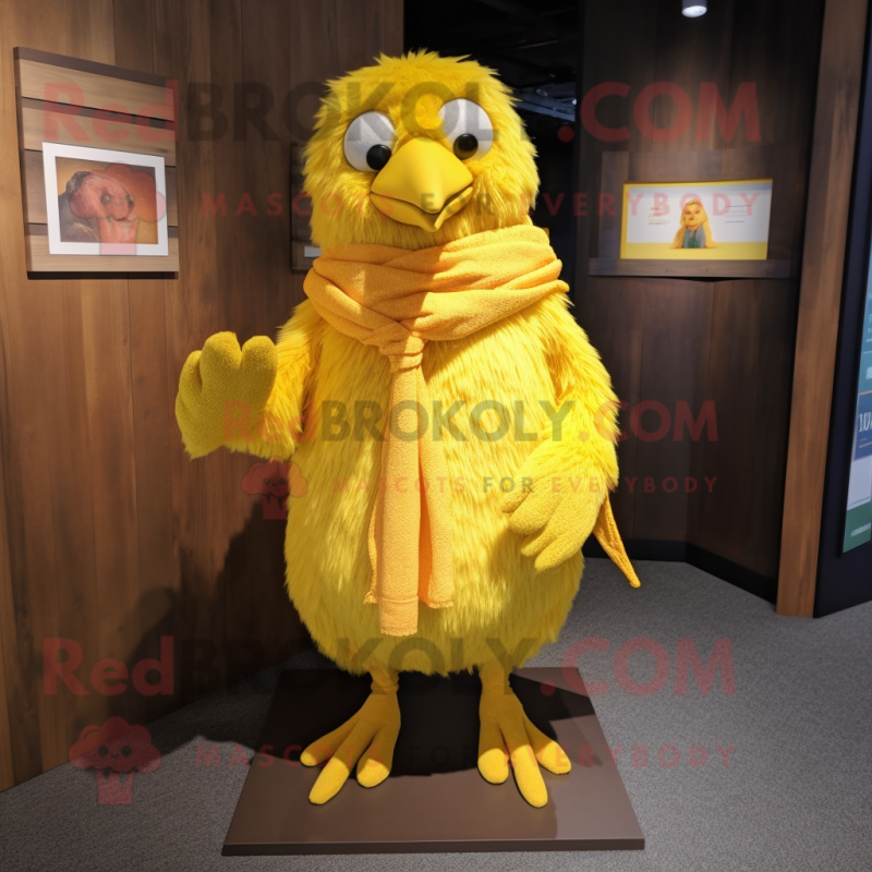 Yellow Canary mascot costume character dressed with a Corduroy Pants and Shawl pins Yellow Canary mascot costume character dressed with a Corduroy Pants and Shawl pins