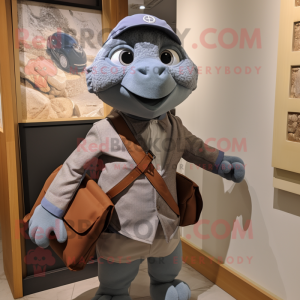 Gray Sea Turtle mascot costume character dressed with a Oxford Shirt and Messenger bags