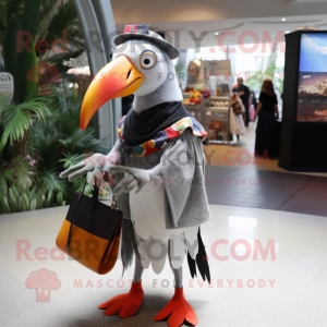 Silver Toucan mascot costume character dressed with a Dress and Handbags
