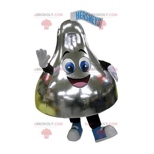 Mascota en forma de campana dorada muy sonriente -
