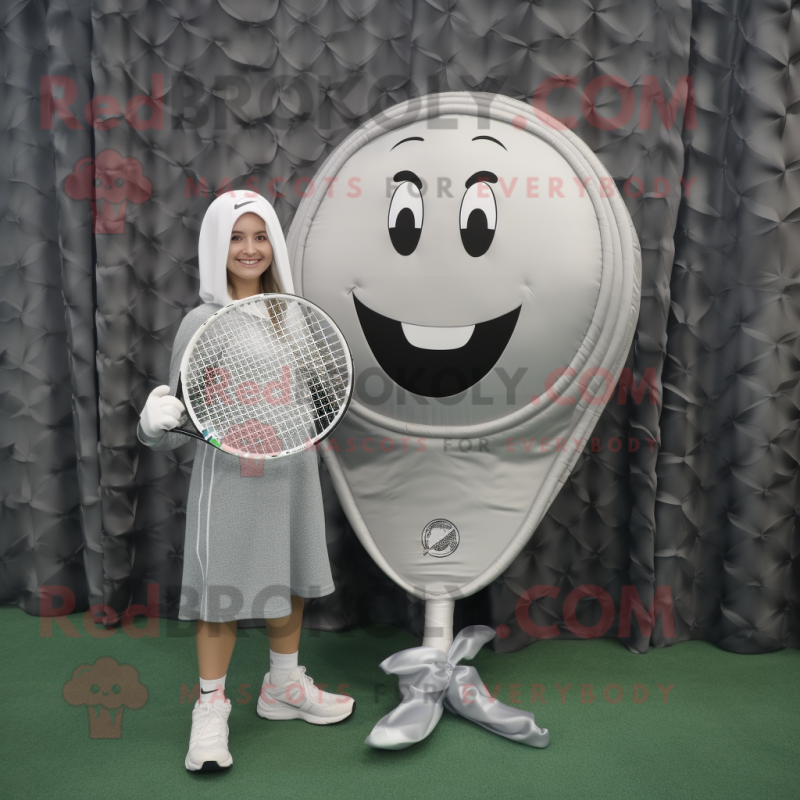 Silver Tennis Racket mascot costume character dressed with a Leggings and Shawl pins Silver Tennis Racket mascot costume character dressed with a Leggings and Shawl pins