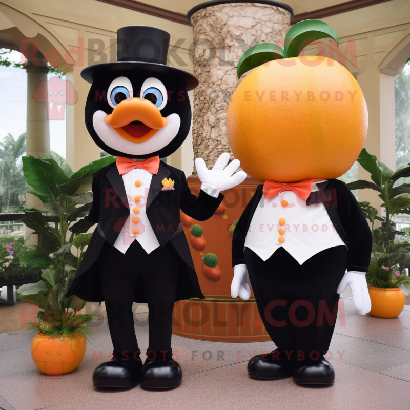Peach Mandarin mascot costume character dressed with a Tuxedo and Rings Peach Mandarin mascot costume character dressed with a Tuxedo and Rings