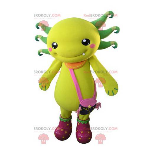 Mascotte creatura gialla e verde con una borsa a tracolla -