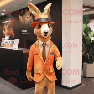 Peach Kangaroo mascot costume character dressed with a Suit Jacket and Hat pins