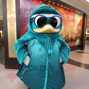Teal Queen mascot costume character dressed with a Parka and Sunglasses