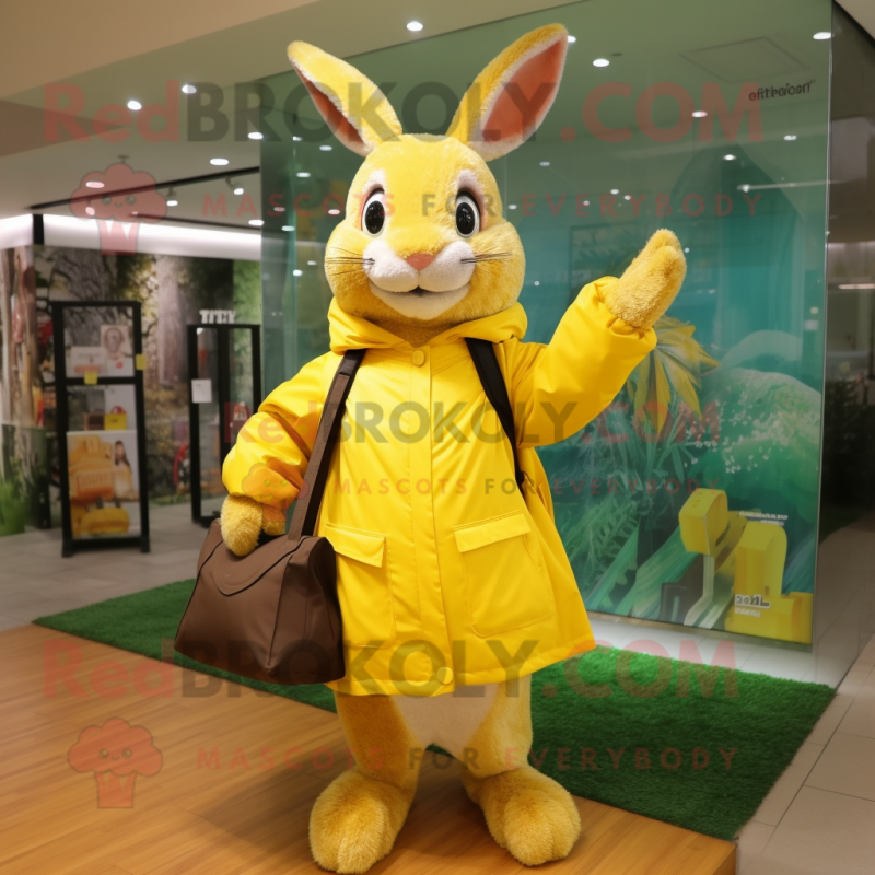 Yellow Wild Rabbit mascot costume character dressed with a Raincoat and Tote bags Yellow Wild Rabbit mascot costume character dressed with a Raincoat and Tote bags
