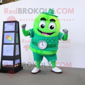 Green Wedding Cake mascot costume character dressed with a Shorts and Digital watches