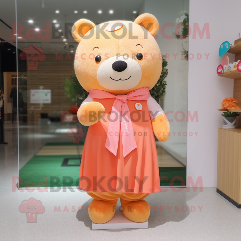 Peach Bear mascot costume character dressed with a Pencil Skirt and Scarves Peach Bear mascot costume character dressed with a Pencil Skirt and Scarves