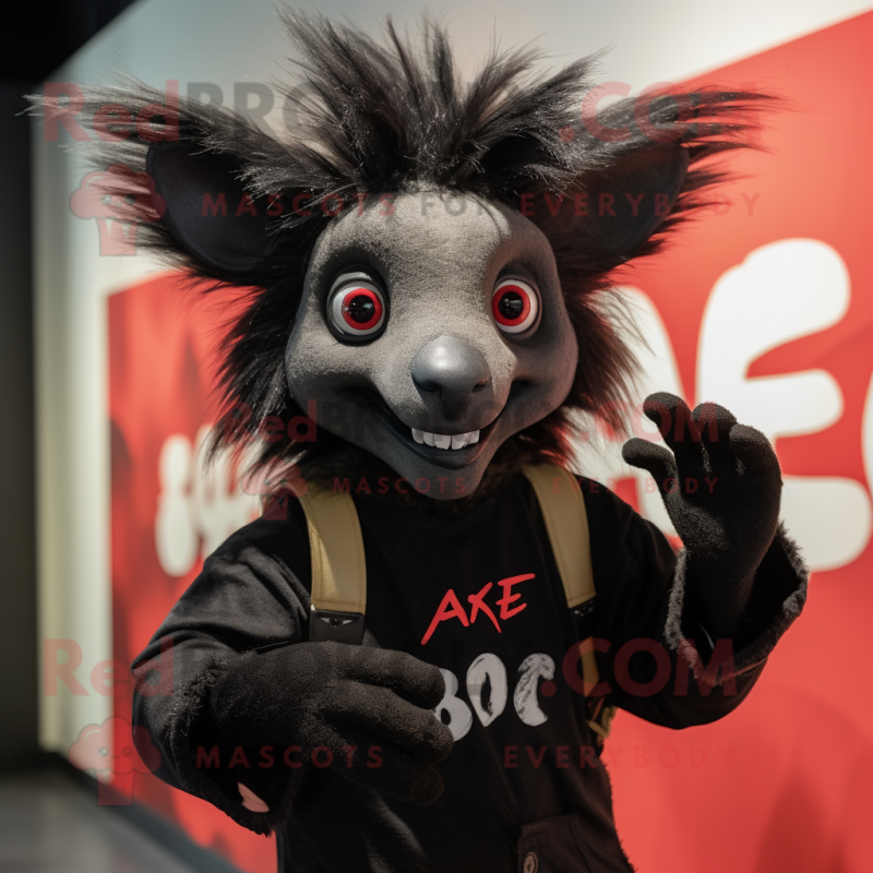 Black Aye-Aye mascot costume character dressed with a Graphic Tee and Gloves