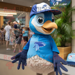 Tan Blue Jay mascot costume character dressed with a Swimwear and Caps