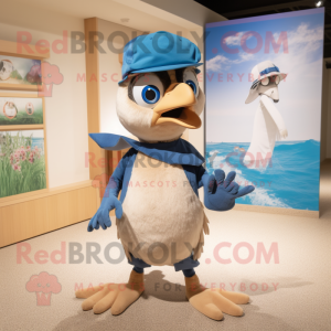 Tan Blue Jay mascot costume character dressed with a Swimwear and Caps