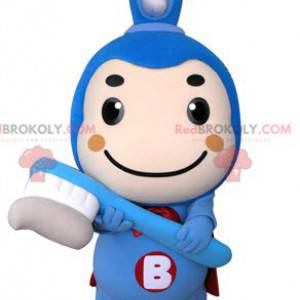 Mascote da escova de dentes azul com uma capa - Redbrokoly.com