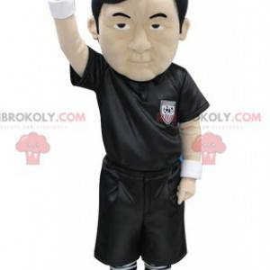 Asiatisches Schiedsrichter-Maskottchen in Schwarz gekleidet -