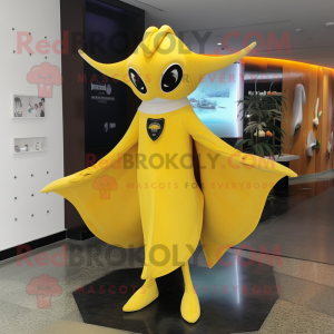 Yellow Manta Ray mascot costume character dressed with a Sheath Dress and Berets