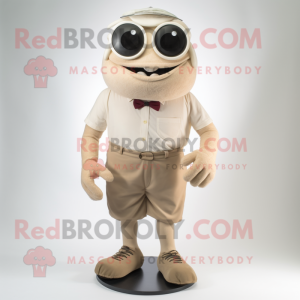 Beige Cyclops mascot costume character dressed with a Bermuda Shorts and Tie pins