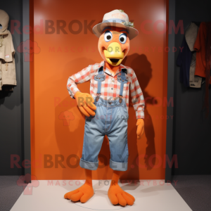 Orange Turkey mascot costume character dressed with a Chambray Shirt and Belts